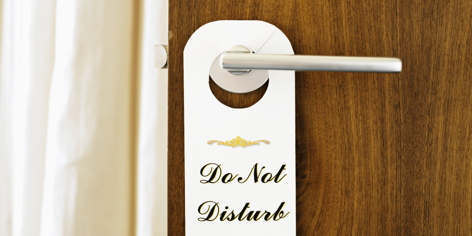 'Do Not Disturb' sign on door handle